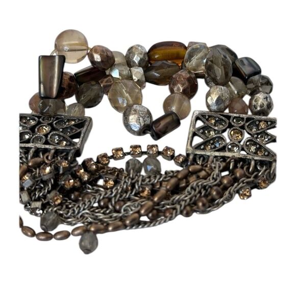 Multi-strand chains, rhinestones, brown and neutral-toned beads bracelet. - Picture 3 of 7